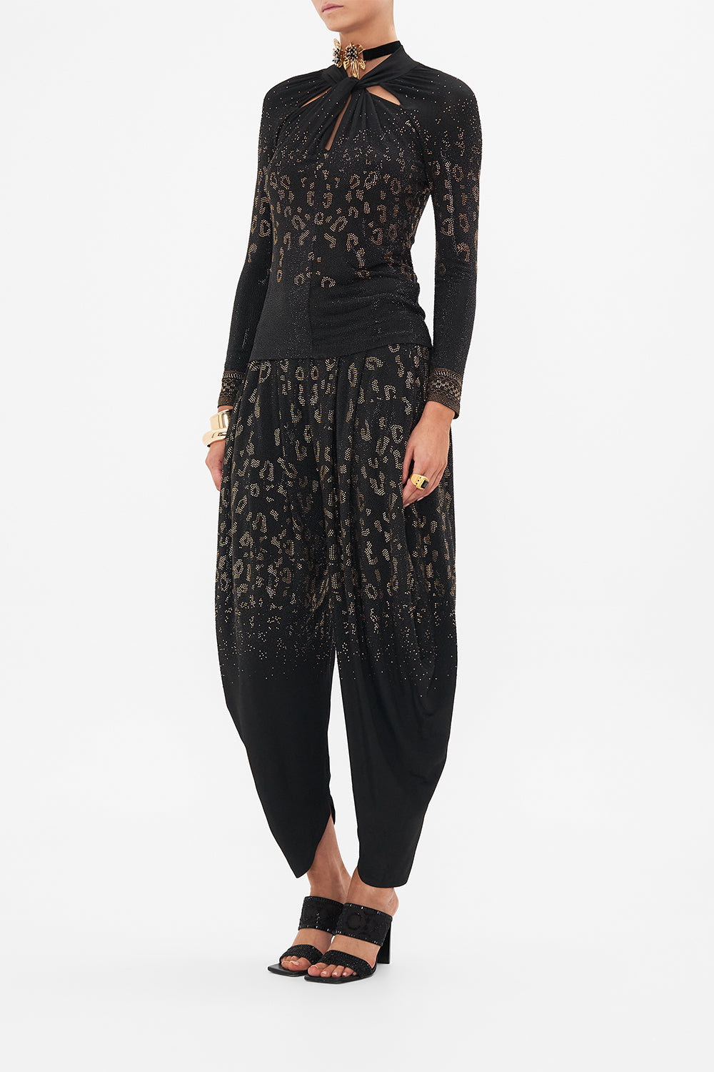 Side view of model wearing CAMILLA black jersey top in Mosaic Muse