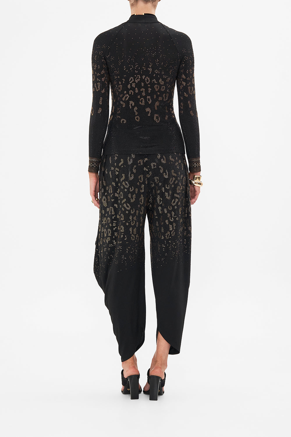 Back view of model wearing CAMILLA black jersey top in Mosaic Muse