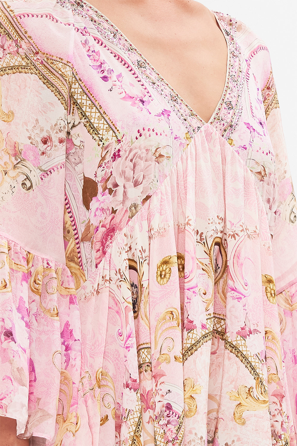 Detail view of model wearing CAMILLA pink silk dress in Fresco Fairytale print