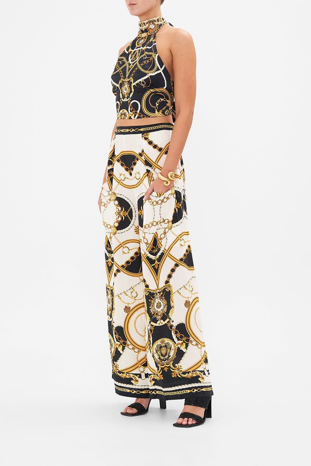 Side view of model wearing CAMILLA silk palazzo pants in Sea Charm print