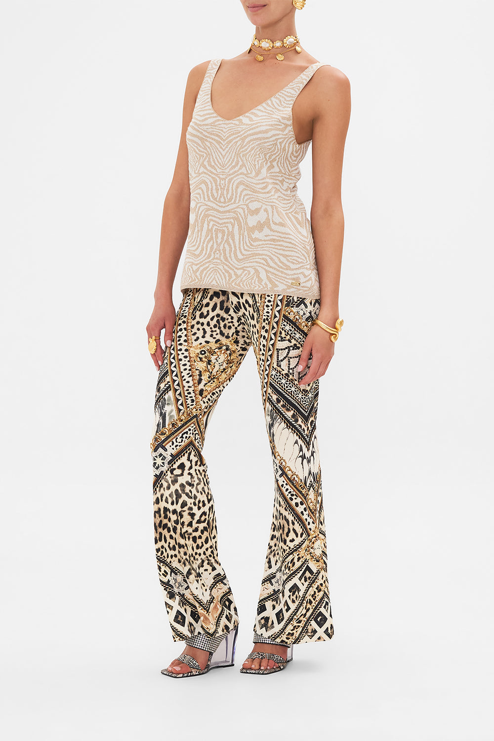 Side view of model wearing CAMILLA designer animal print knit top in Mosaic Muse