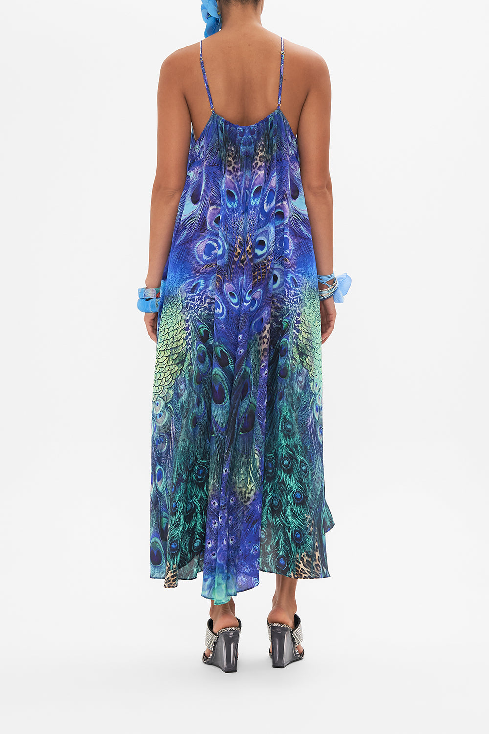 Back view of model wearing CAMILLA silk maxi dress in Peacock Rock print