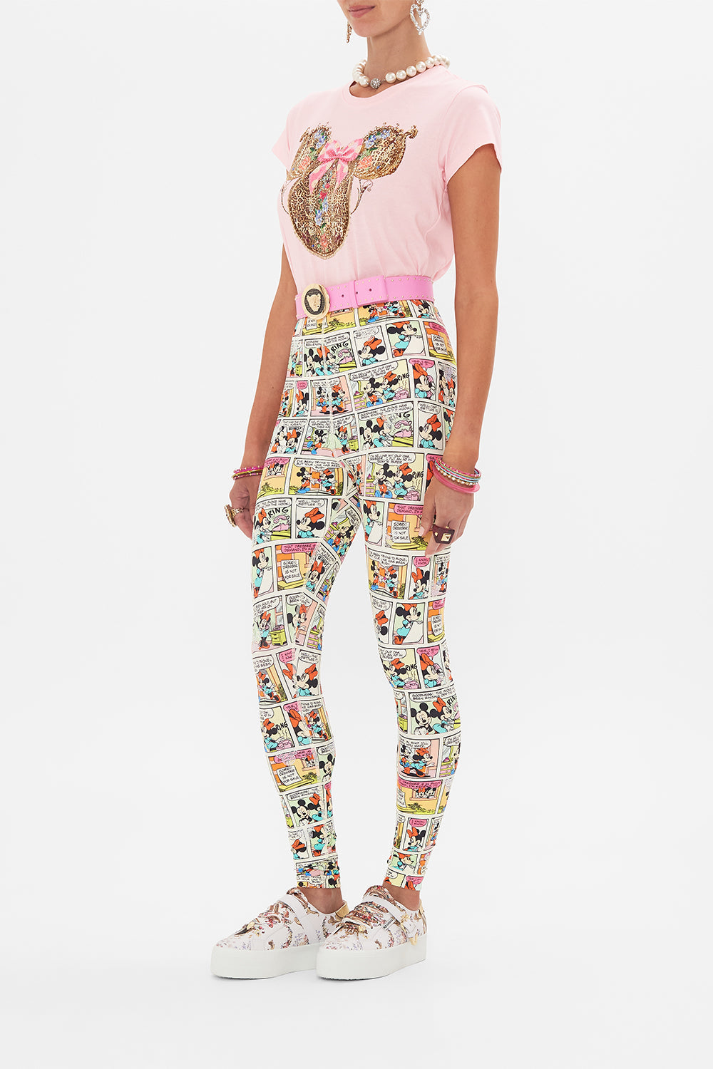Side view of model wearing CAMILLA x Disney leggings in A Trip Down Comic Strip print