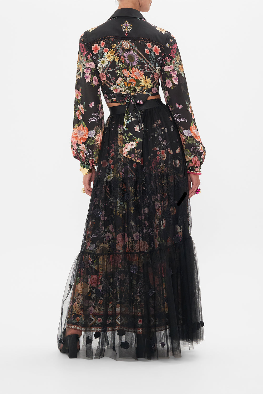 Back view of model wearing CAMILLA ruffle skirt in Letters From A Vineyard print