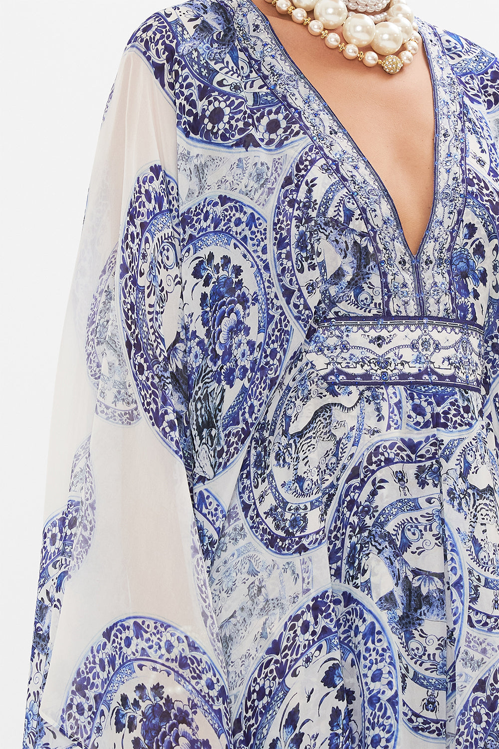 Detail view of model wearing CAMILLA silk kaftan in Glaze and Graze print