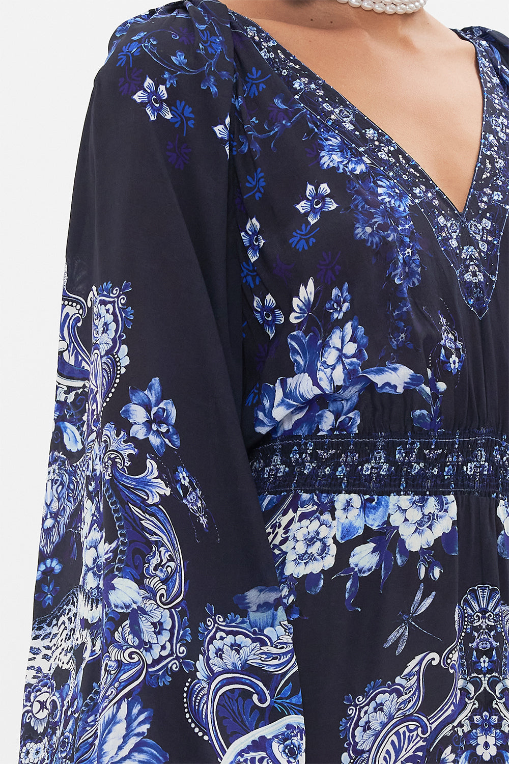 Detail view of model wearing CAMILLA silk dress in Delft Dynasty print