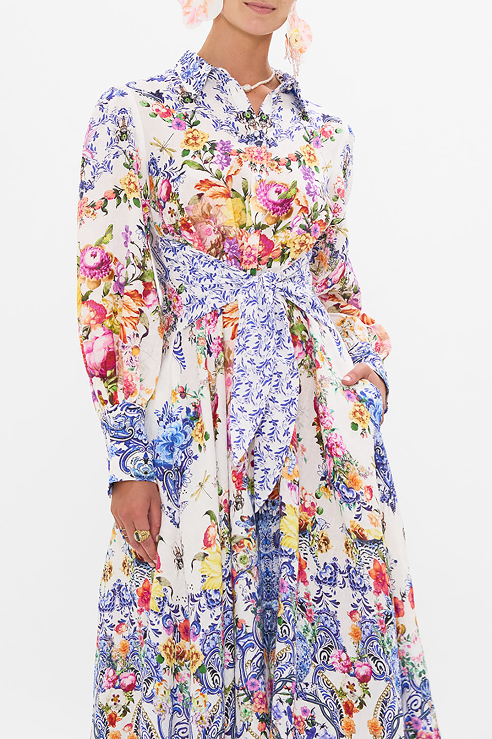 Crop view of model wearing CAMILLA silk shirt dress in Dutch Is Life print