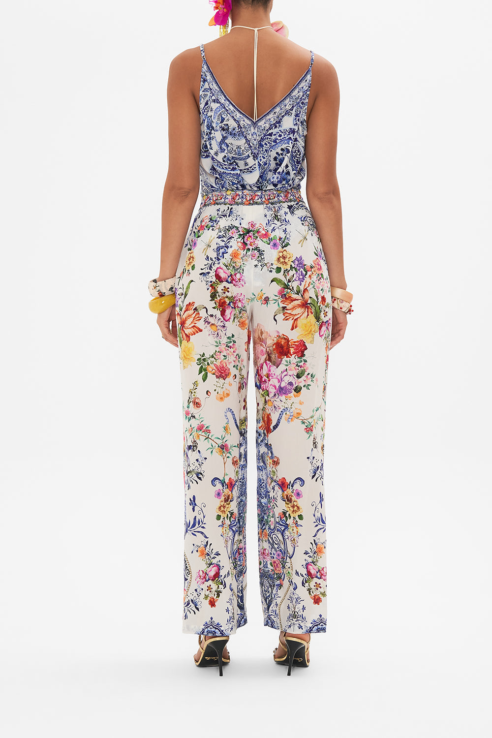 Back view of model wearing CAMILLA silk pants in Dutch Is Life print
