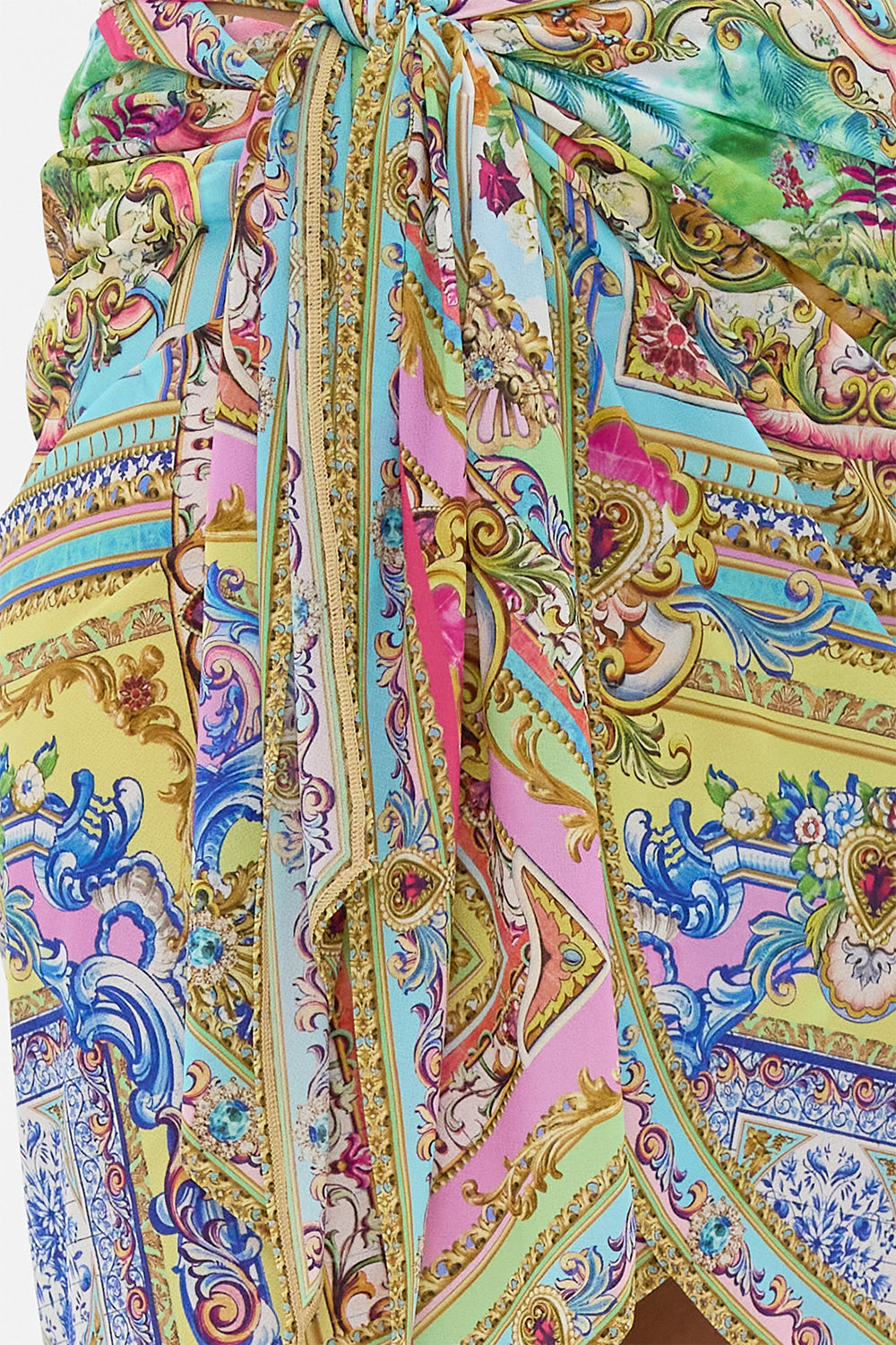 The CAMILLA Eyelet Wrap Mini Skirt With Tie Waist in our Spirit Of Santa Maria print.