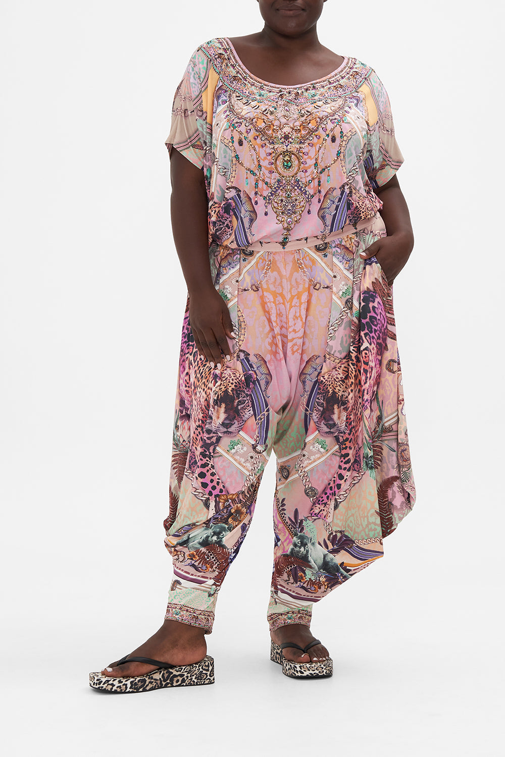 Front view of curvy model wearing CAMILLA plus size jersey drape pants in Kitty Kat Klub print