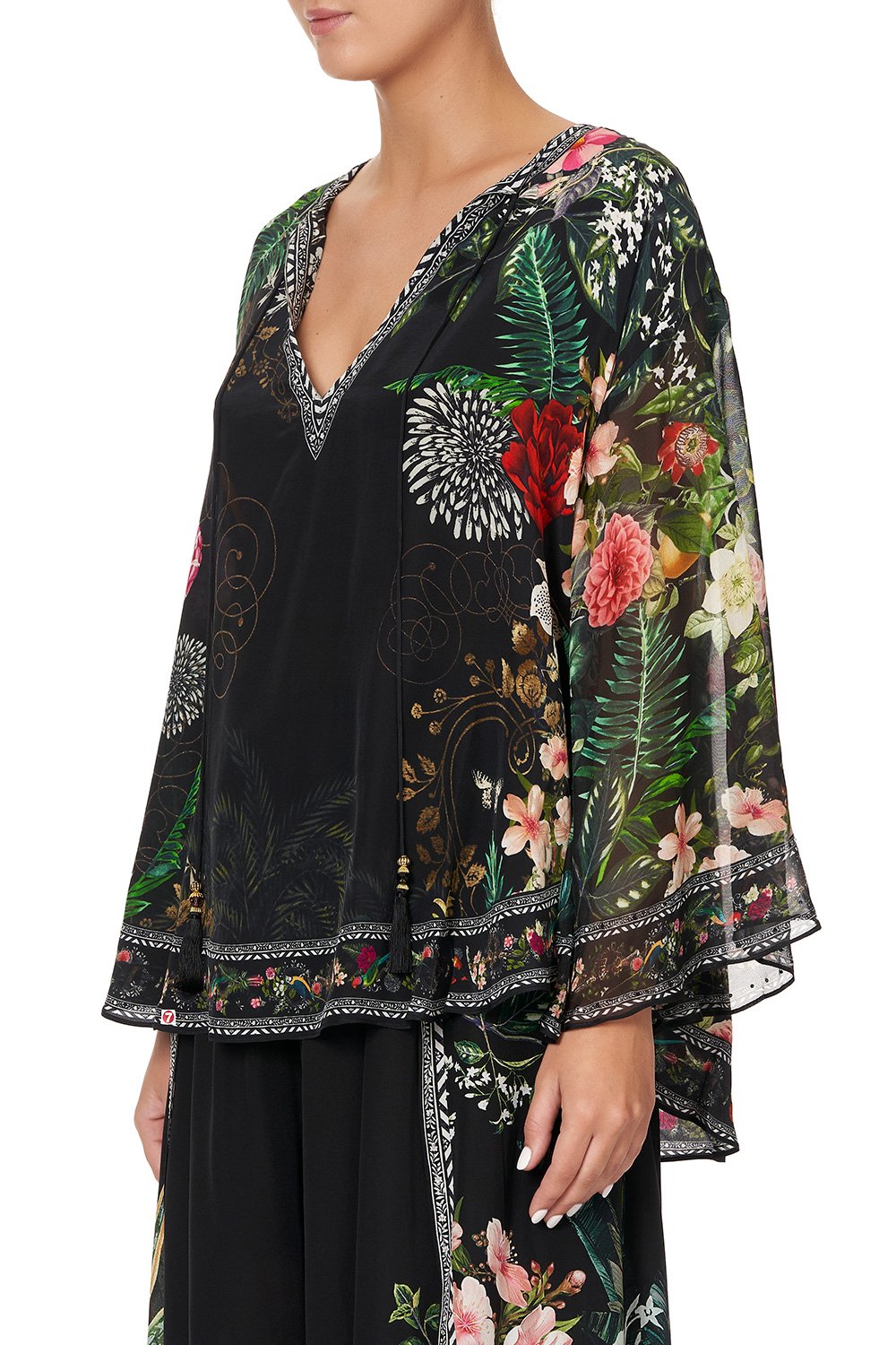 BLOUSE WITH CAPE SLEEVE RAISED WITH WOLVES