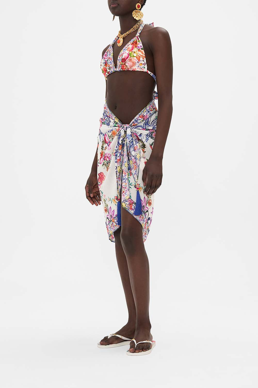Side view of model wearing CAMILLA resort wear sarong in Dutch Is Life print