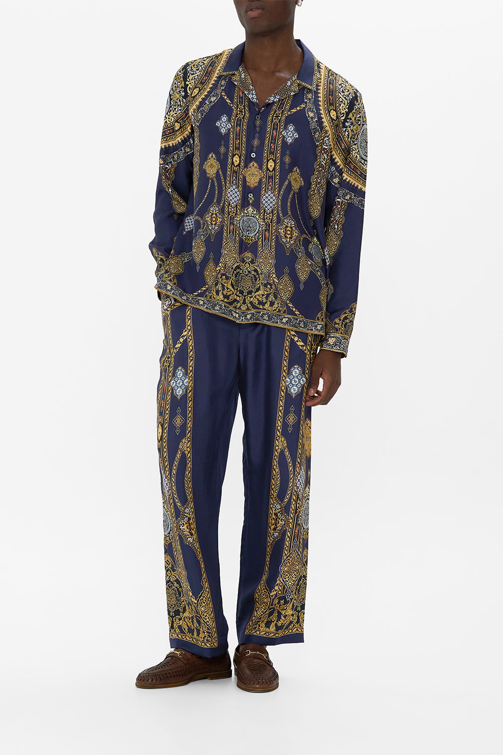 The CAMILLA BUTTON UP TOP WITH DRAPED BACK COSMIC ZOOLOGY in our  print.