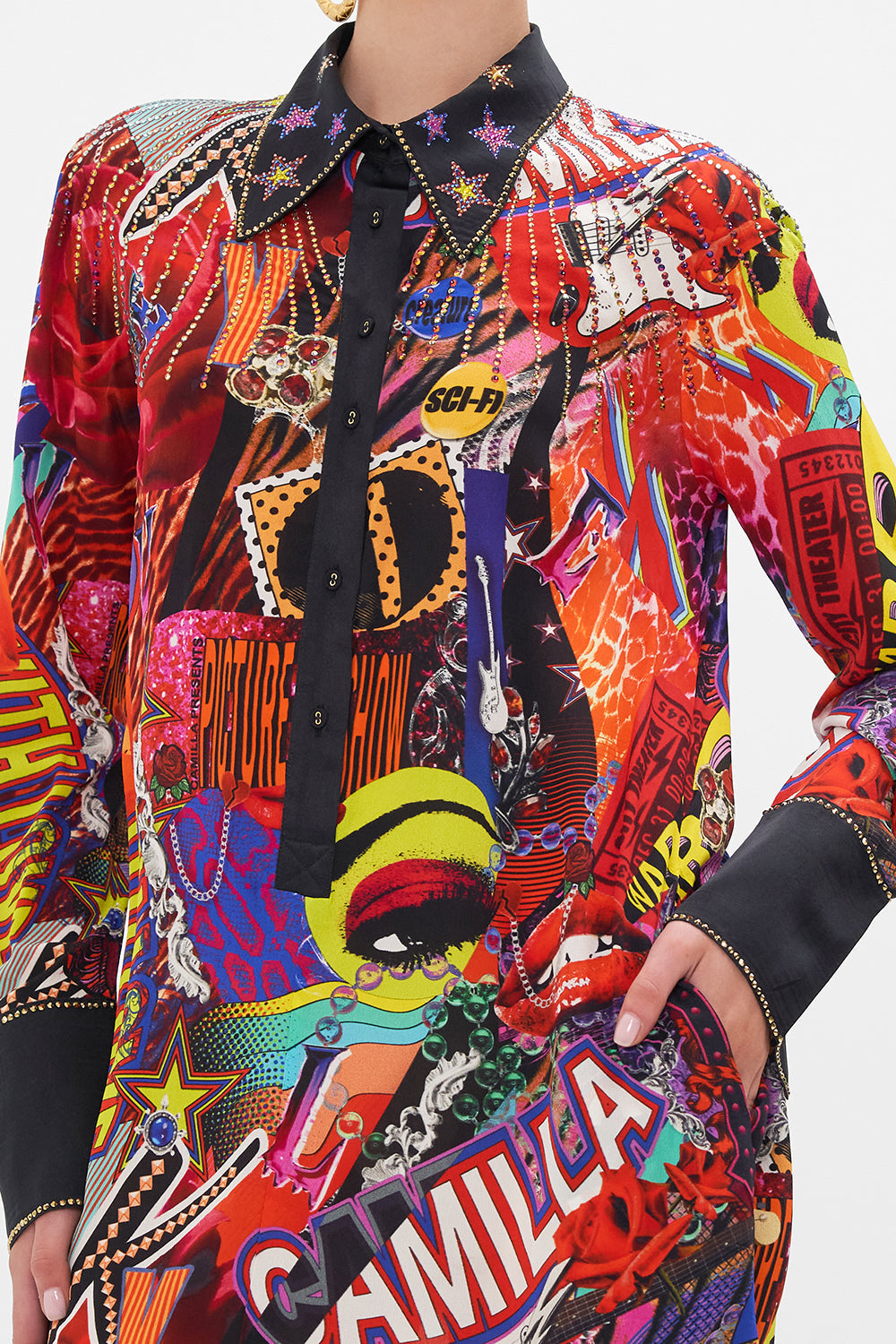 Detail view of model wearing CAMILLA silk mini shirtdress in multicoloured Radical Rebirth print