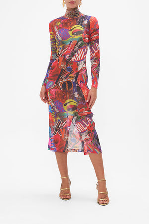 Front view of model wearing CAMILLA mesh turtleneck dress in multicoloured Radical Rebirth print
