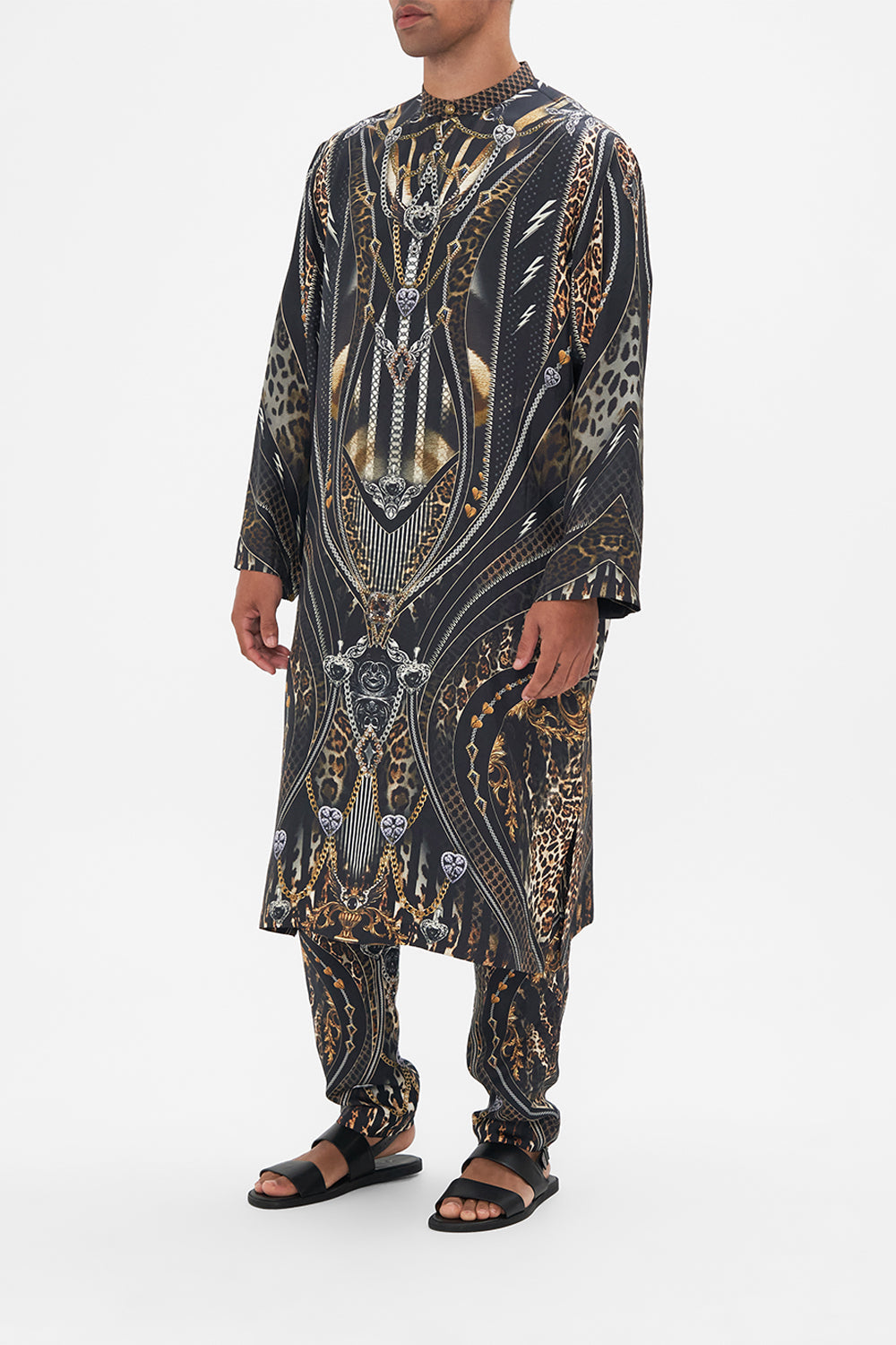 Side view of model wearing Hotel Franks by CAMILLA mens silk kaftan in Chaos In The Cosmos animal print 