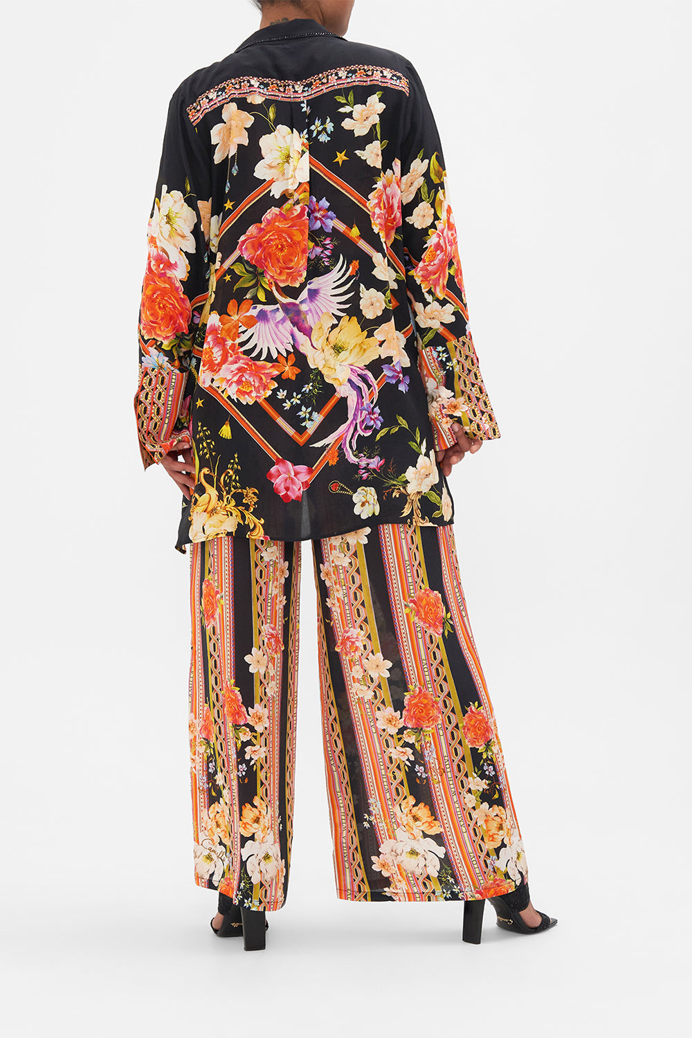 Back view of model wearing CAMILLA  silk jacket in Secret History floral print