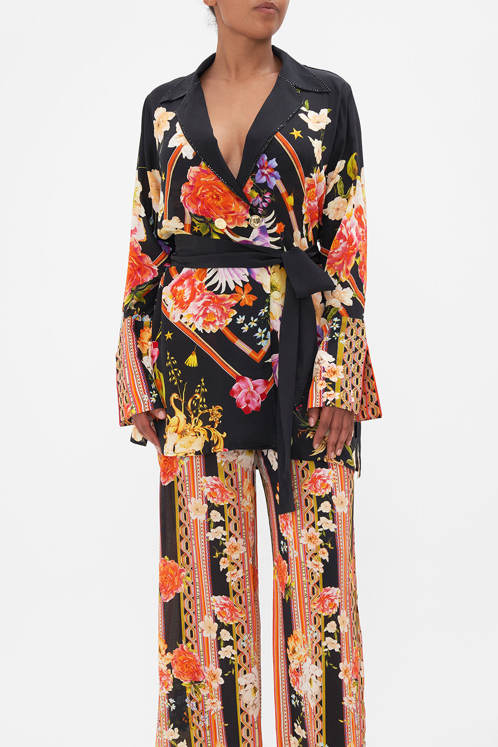 Crop view of model wearing CAMILLA  silk jacket in Secret History floral print