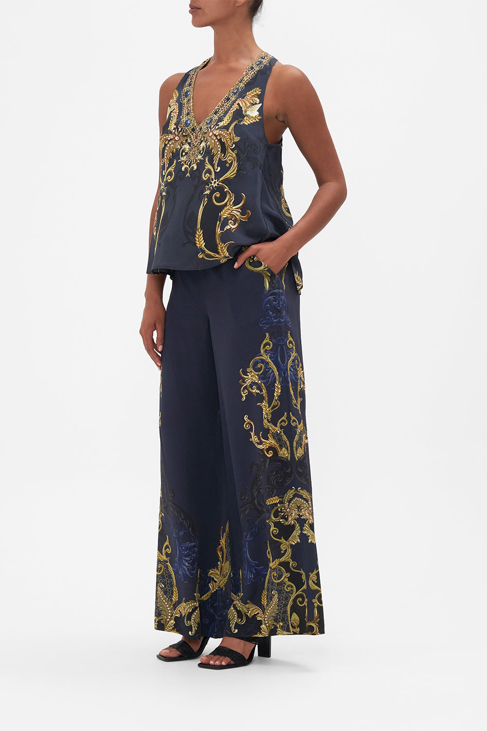 Side view of model wearing CAMILLA silk top in Moonlight Melodiesprint 