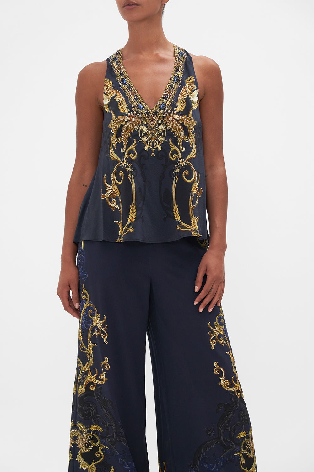 Crop view of model wearing CAMILLA silk top in Moonlight Melodiesprint 