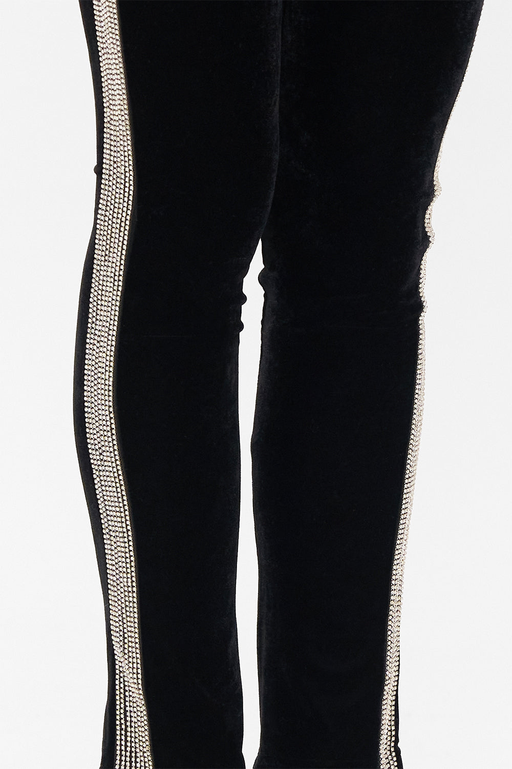 Detail view of model wearing CAMILLA black velvet pants in Curtain Call Chaos