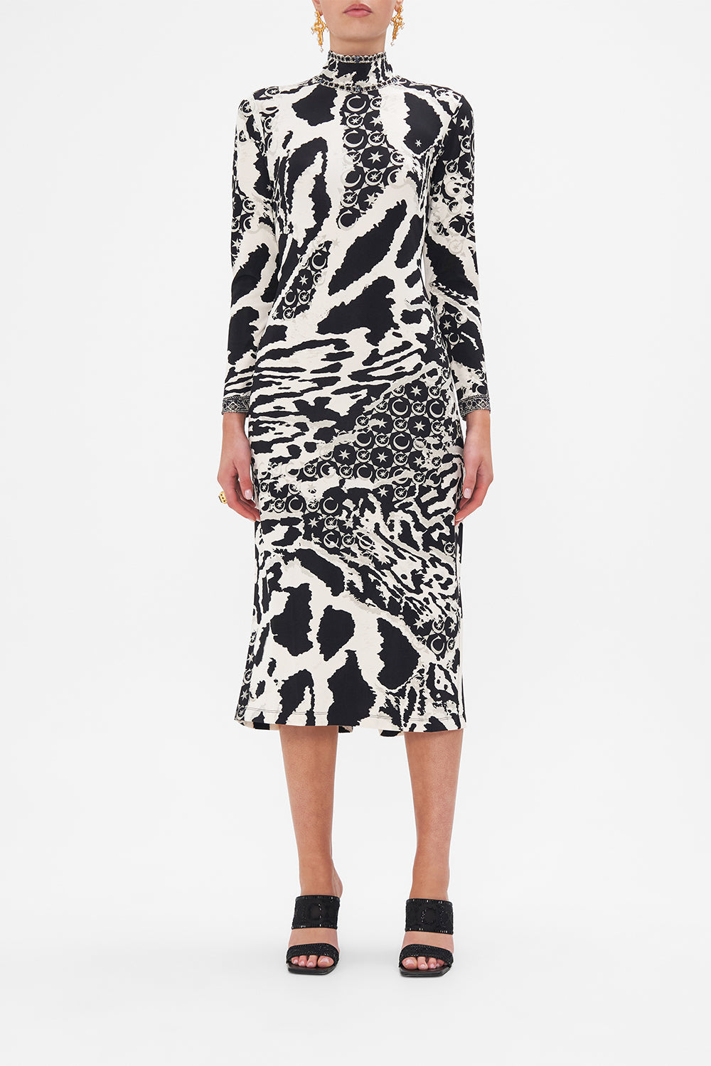 Front view of model wearing CAMILLA black and white jersey midi dress in Feline Fantasy print