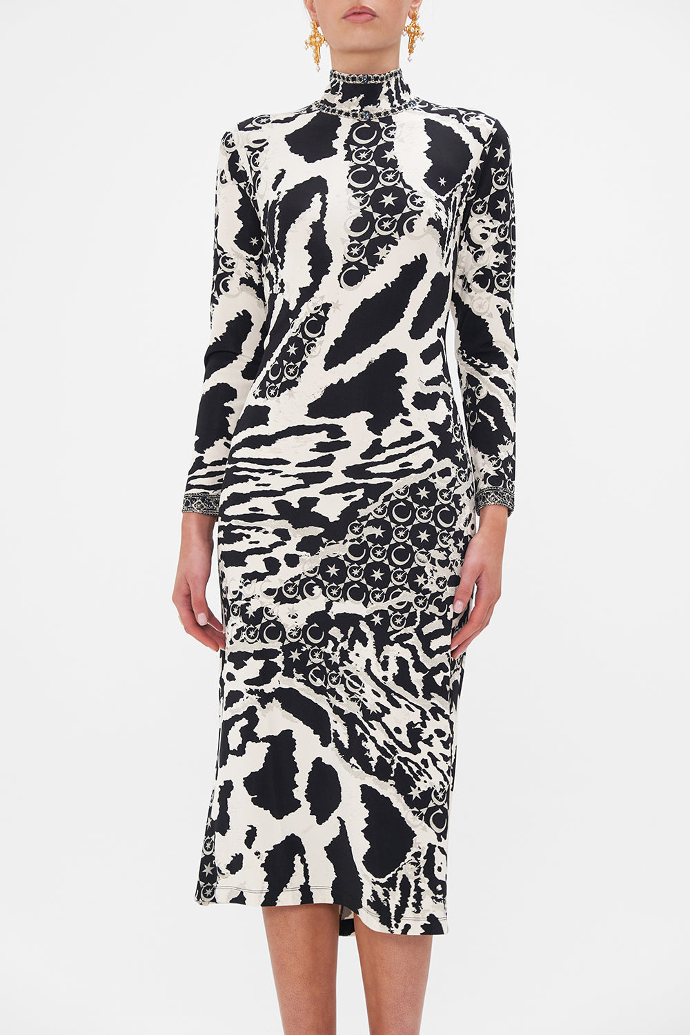 Crop view of model wearing CAMILLA black and white jersey midi dress in Feline Fantasy print