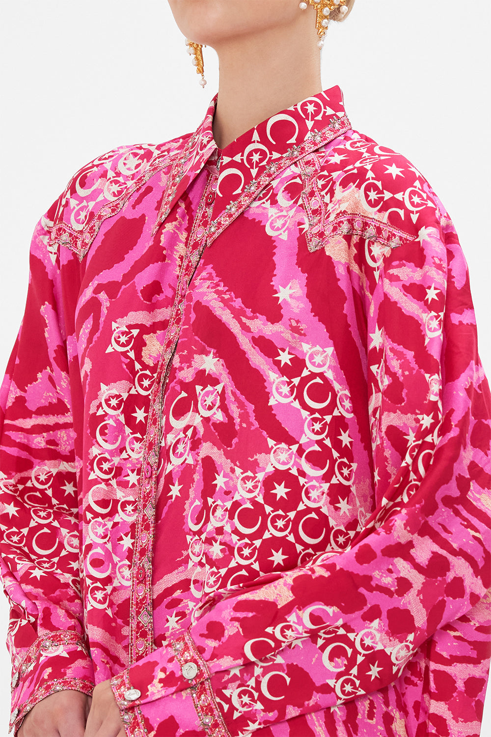 Detail view of model wearing CAMILLA silk shirt in Song Of Sacrifice print