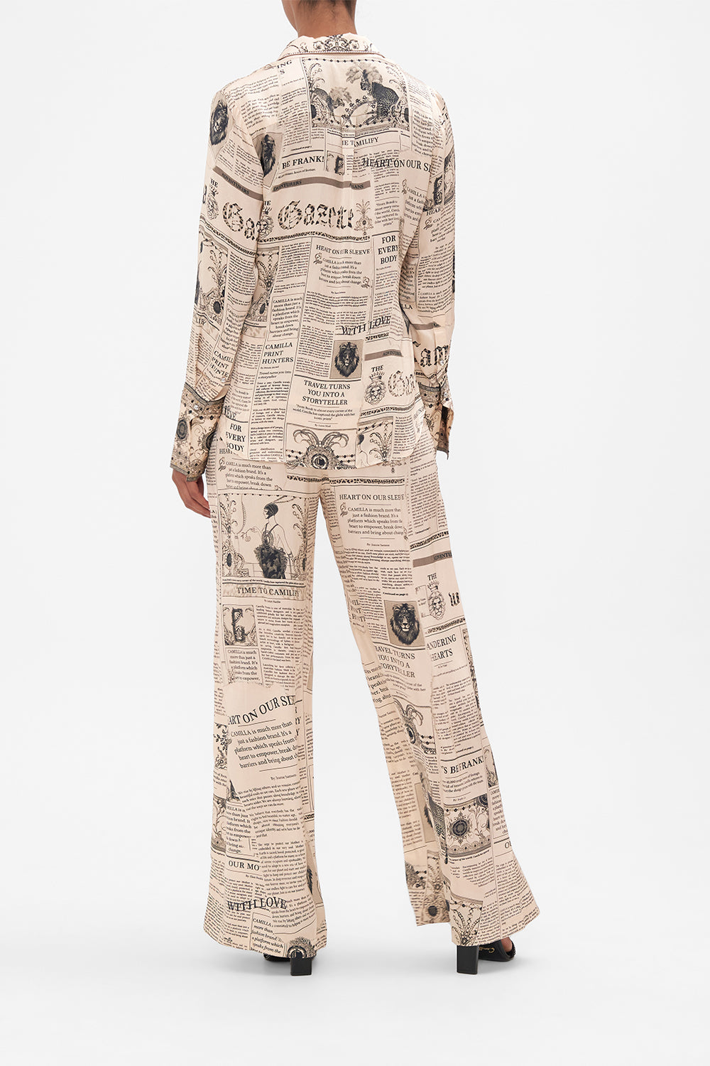 Back view of model wearing CAMILLA pink silk pyjama shirt in Fame Fever print 