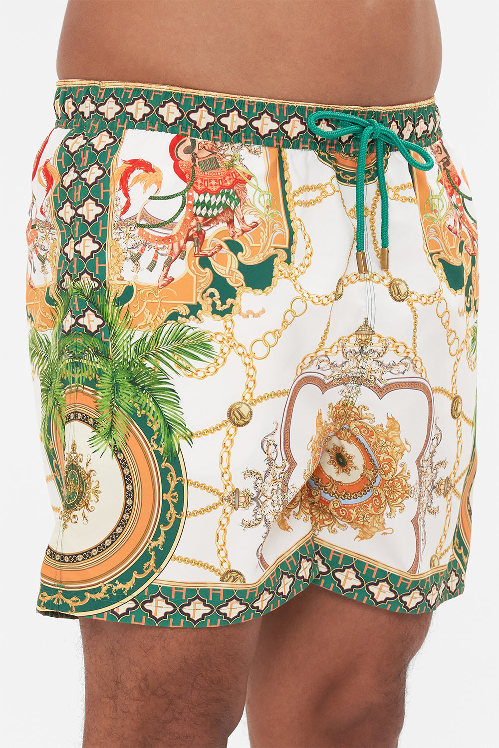 Detail view of model wearing Hotel Franks by CAMILLA mens white boardshorts in My Sweet Devotion print