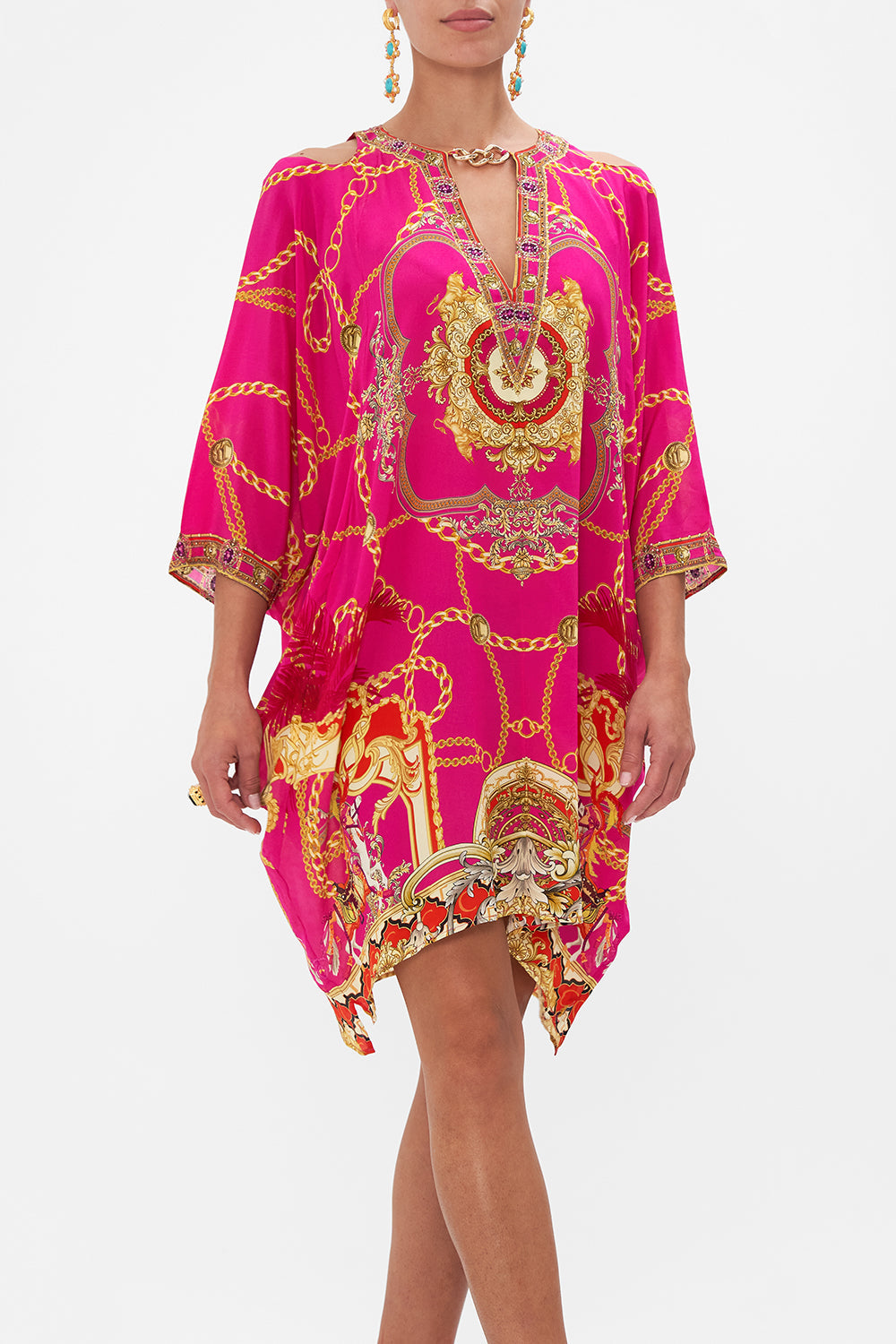Crop view of model wearing CAMILLA pink silk kaftan in Wild And Running print 