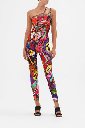 Front view of model wearing CAMILLA catsuit unitard in multicoloured Radical Rebirth print