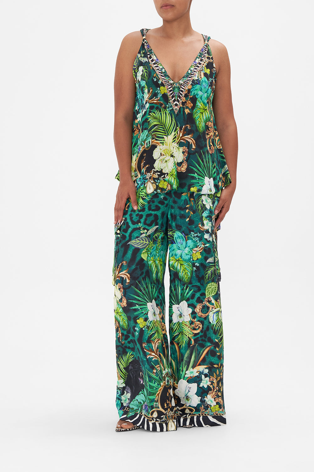 Front view of model wearing CAMILLA green silk tank top in Sing My Song print