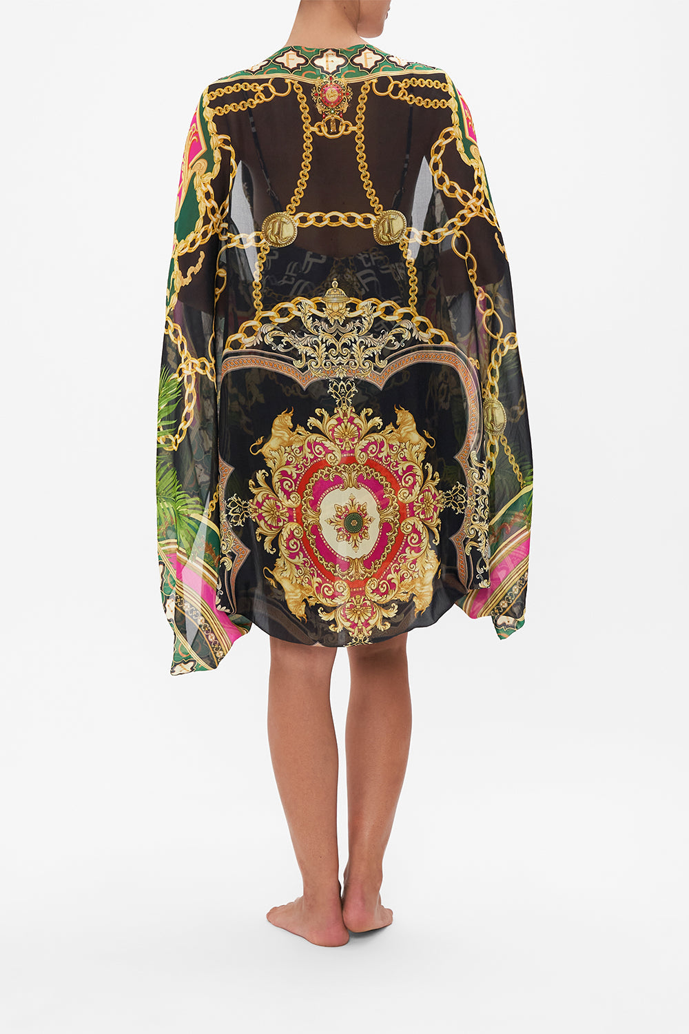 Back view of model wearing CAMILLA silk shrug in Jealousy And Jewels print