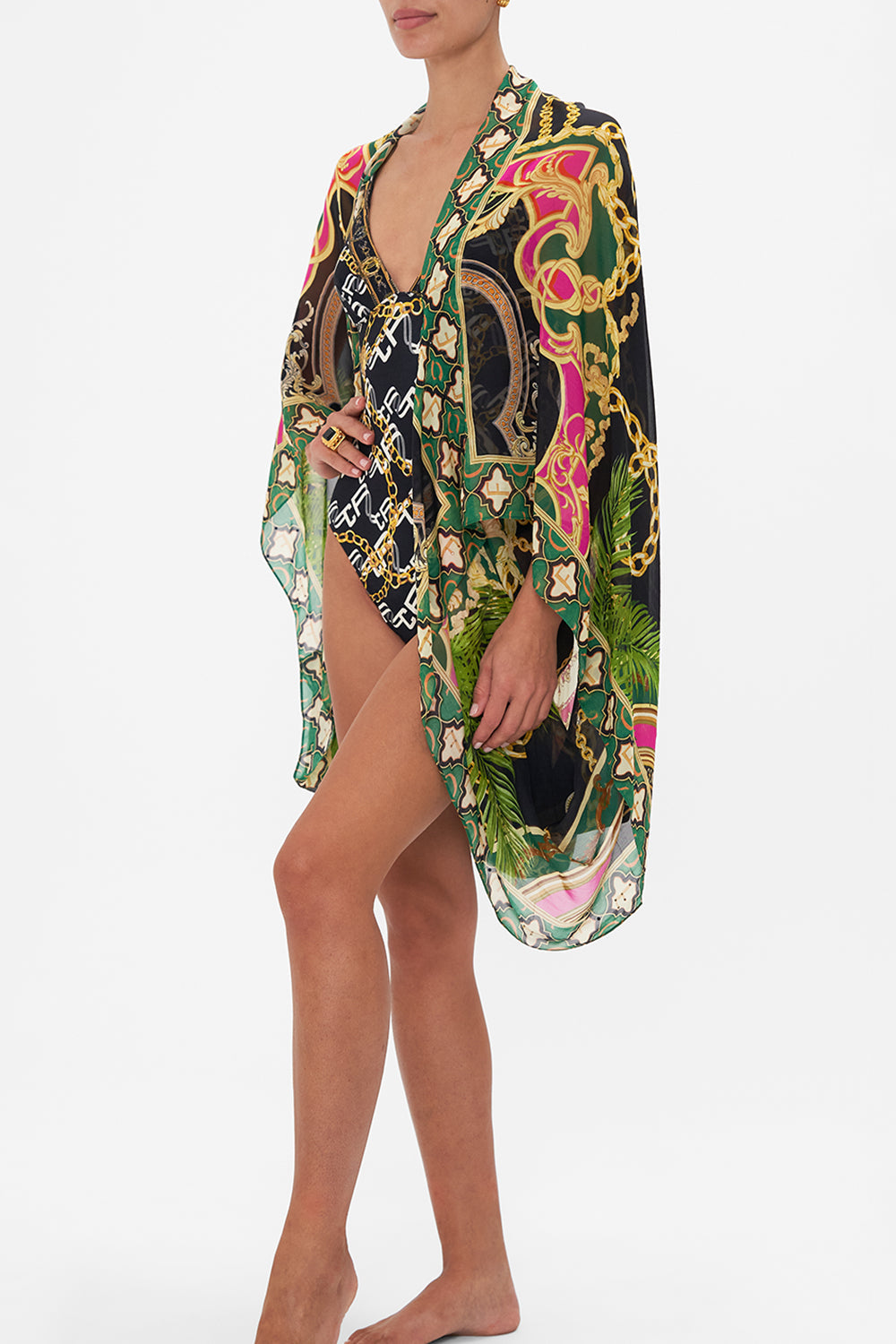 Side crop view of model wearing CAMILLA silk shrug in Jealousy And Jewels print