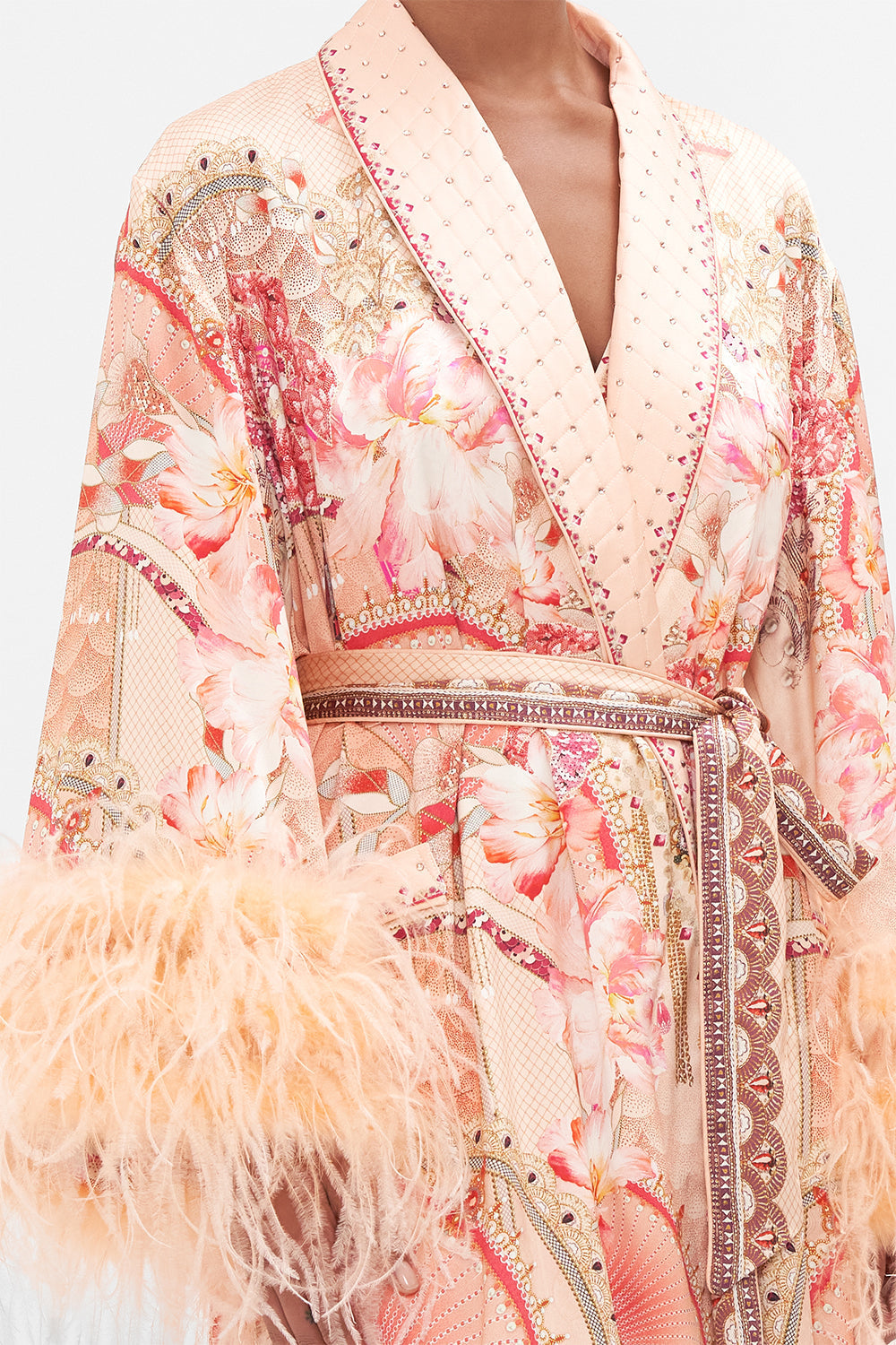 Detail view of model wearing CAMILLA silk robe with feathers in Adore Me pink floral print