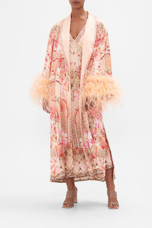 Front view of model wearing CAMILLA silk robe with feathers in Adore Me pink floral print
