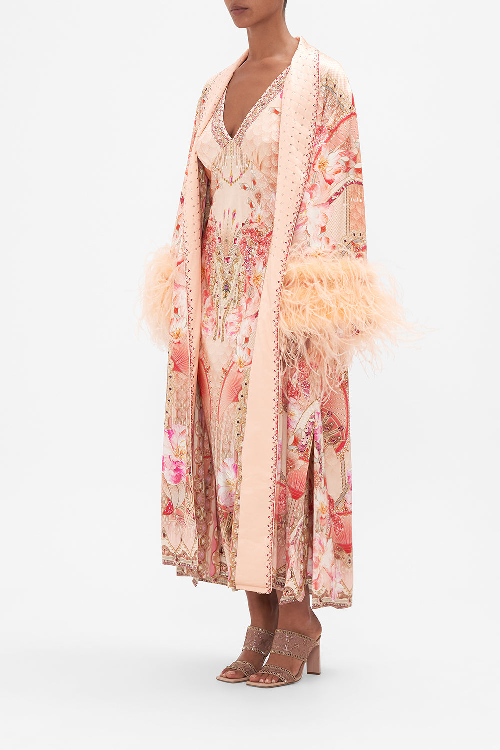 Side view of model wearing CAMILLA silk robe with feathers in Adore Me pink floral print