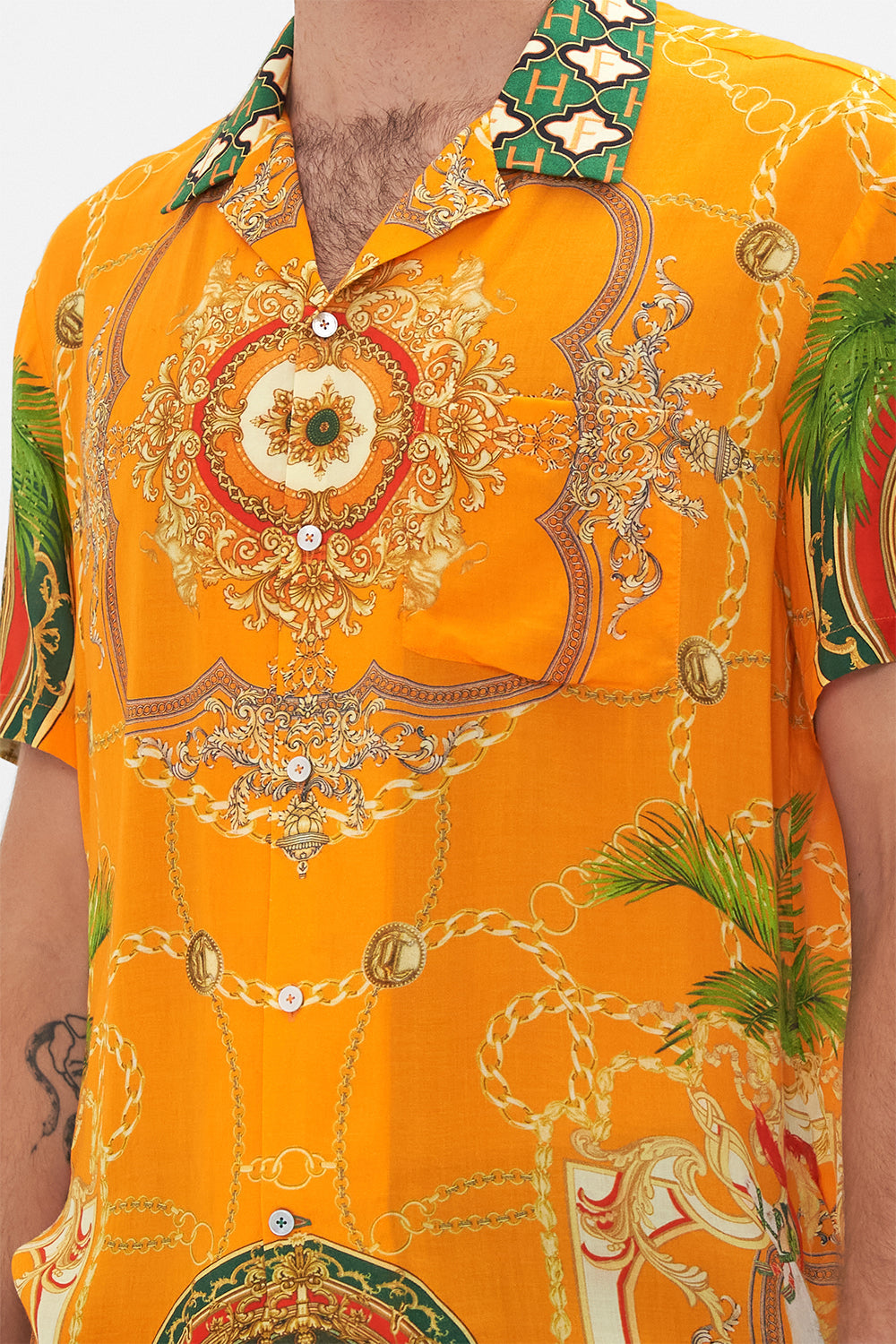 Detail view of model wearing Hotel Franks by CAMILLA mens orange short sleeve camp collared shirt in Dancing With The Bulls print