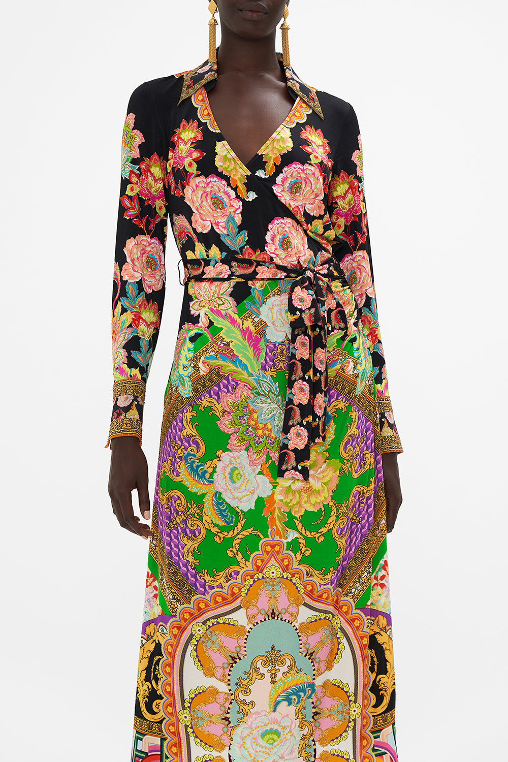 Crop view of model wearing CAMILLA printed jersey wrap dress in Sundowners In Sicily print