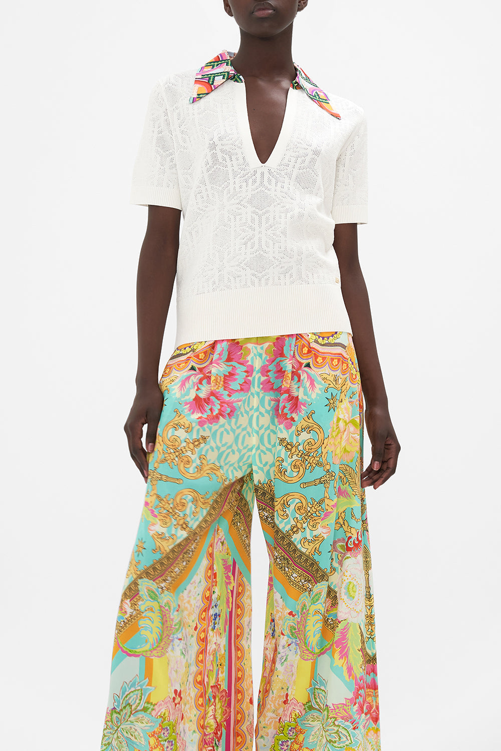 Crop view of model wearing CAMILLA white knit polo  top in An Italian Welcome print