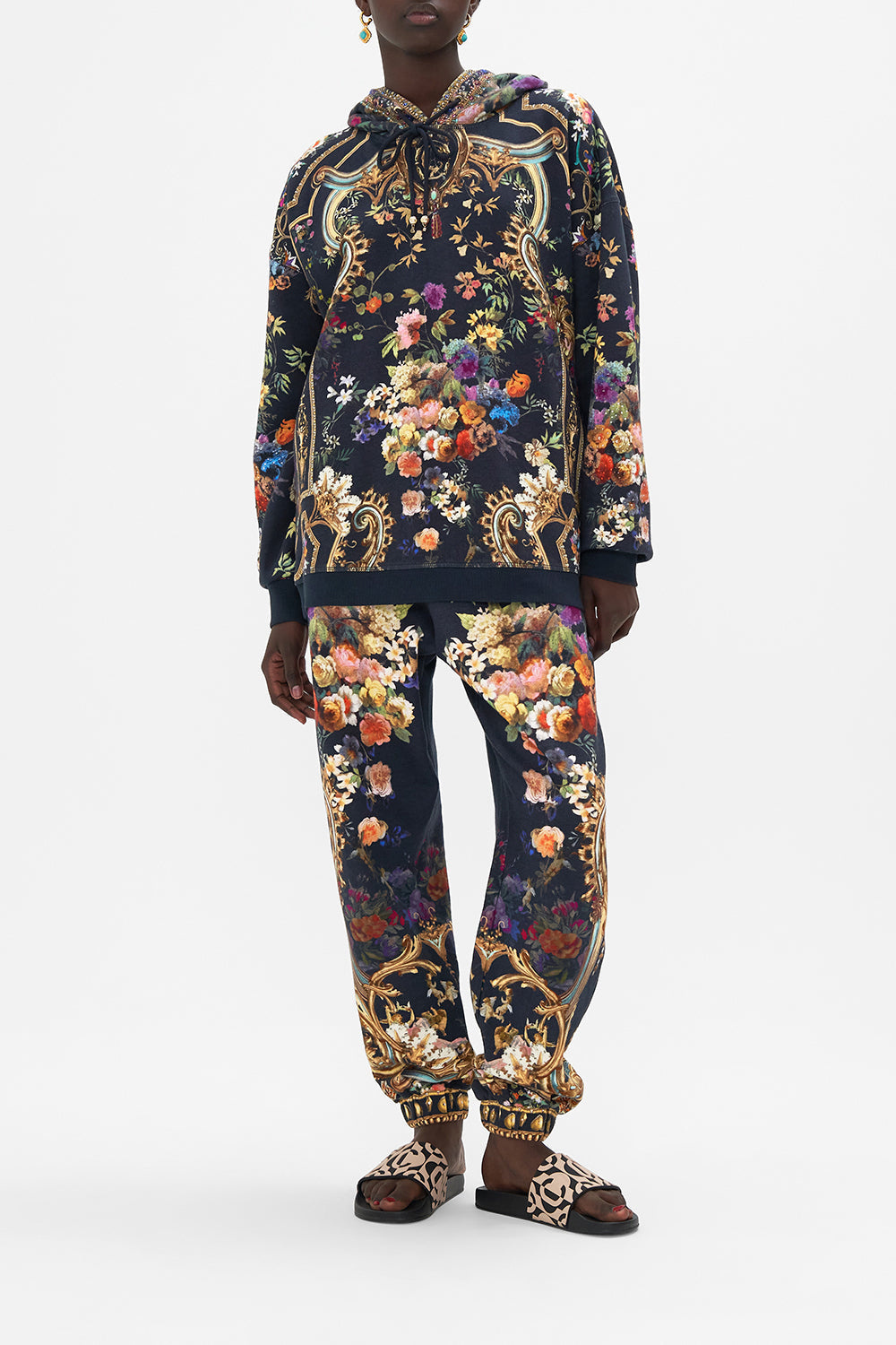 Front view of model wearing CAMILLA printed hoodie in Play Your Cards Right print