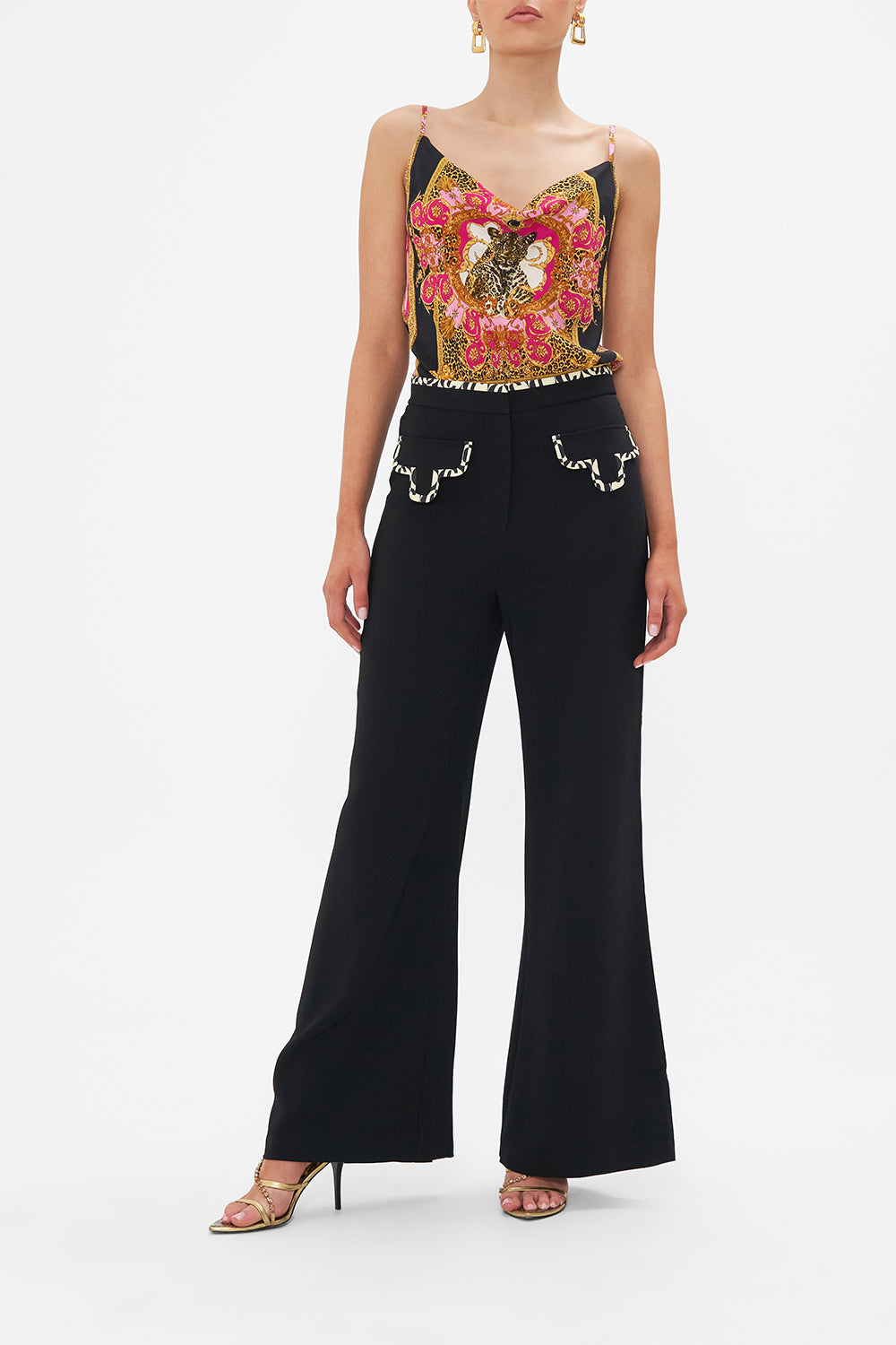 Front view of model wearing CAMILLA black flared pants in Ciao Palazzo