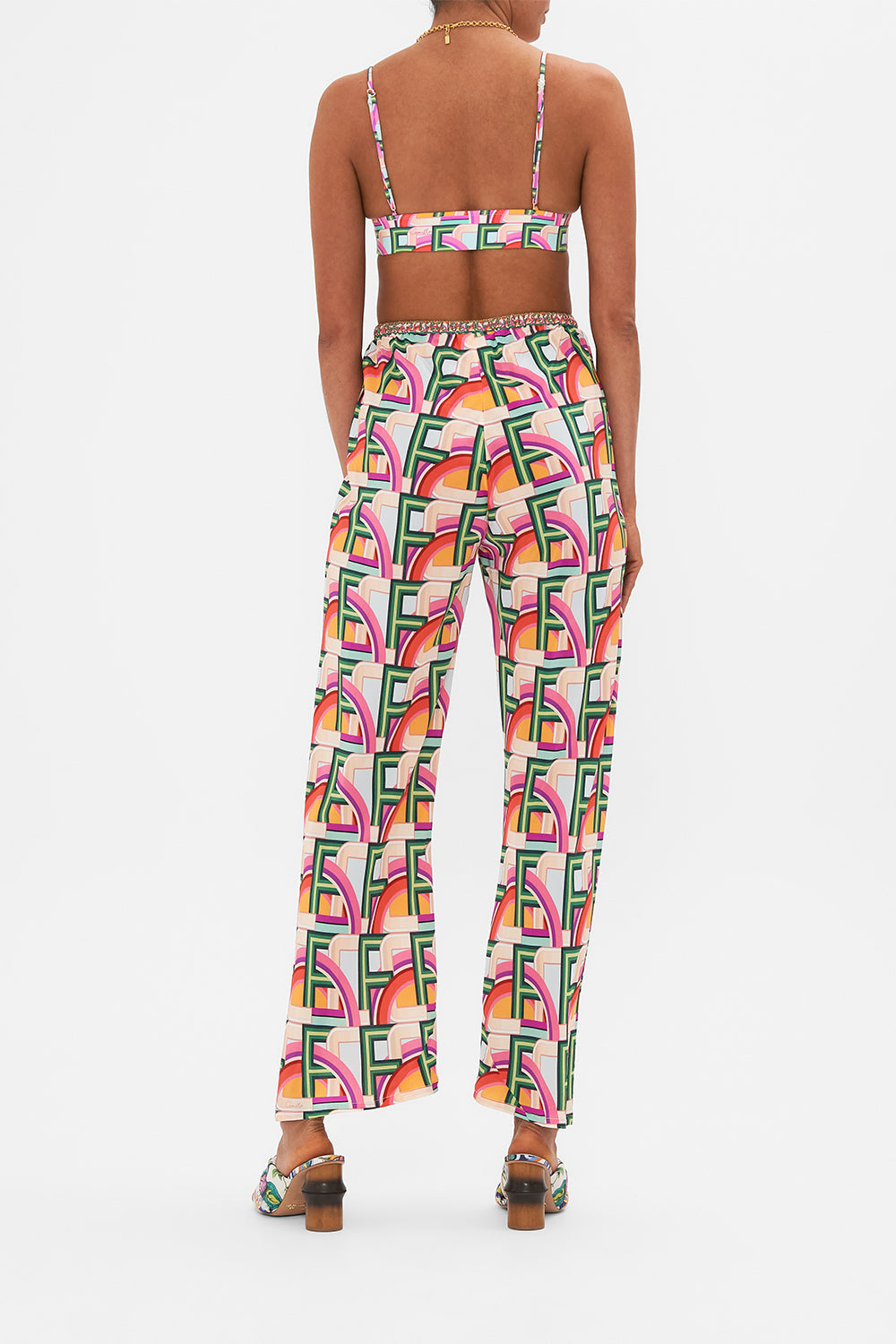 Back view of model wearing CAMILLA silk drawstring pant in An Italian Welcome print