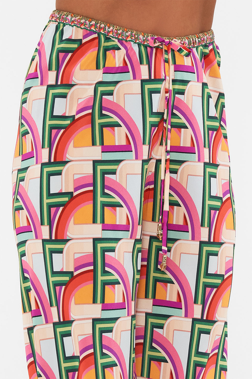 Detail view of model wearing CAMILLA silk drawstring pant in An Italian Welcome print