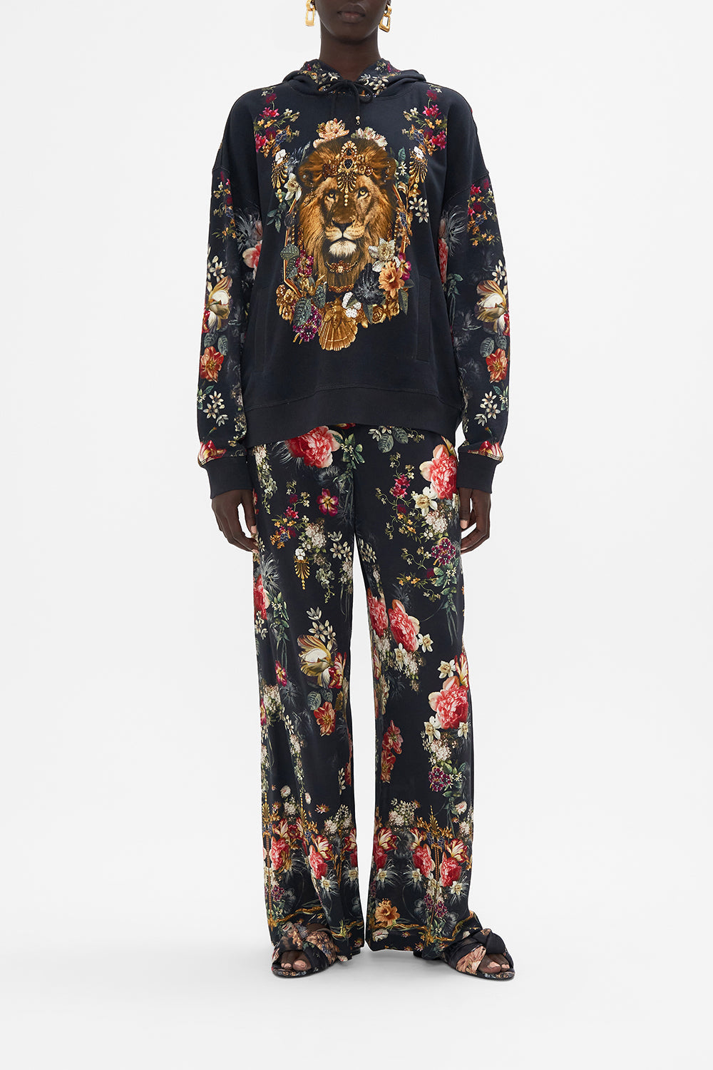 Front view of model wearing CAMILLA printed hoodie with side pockets in A Night At The Opera print