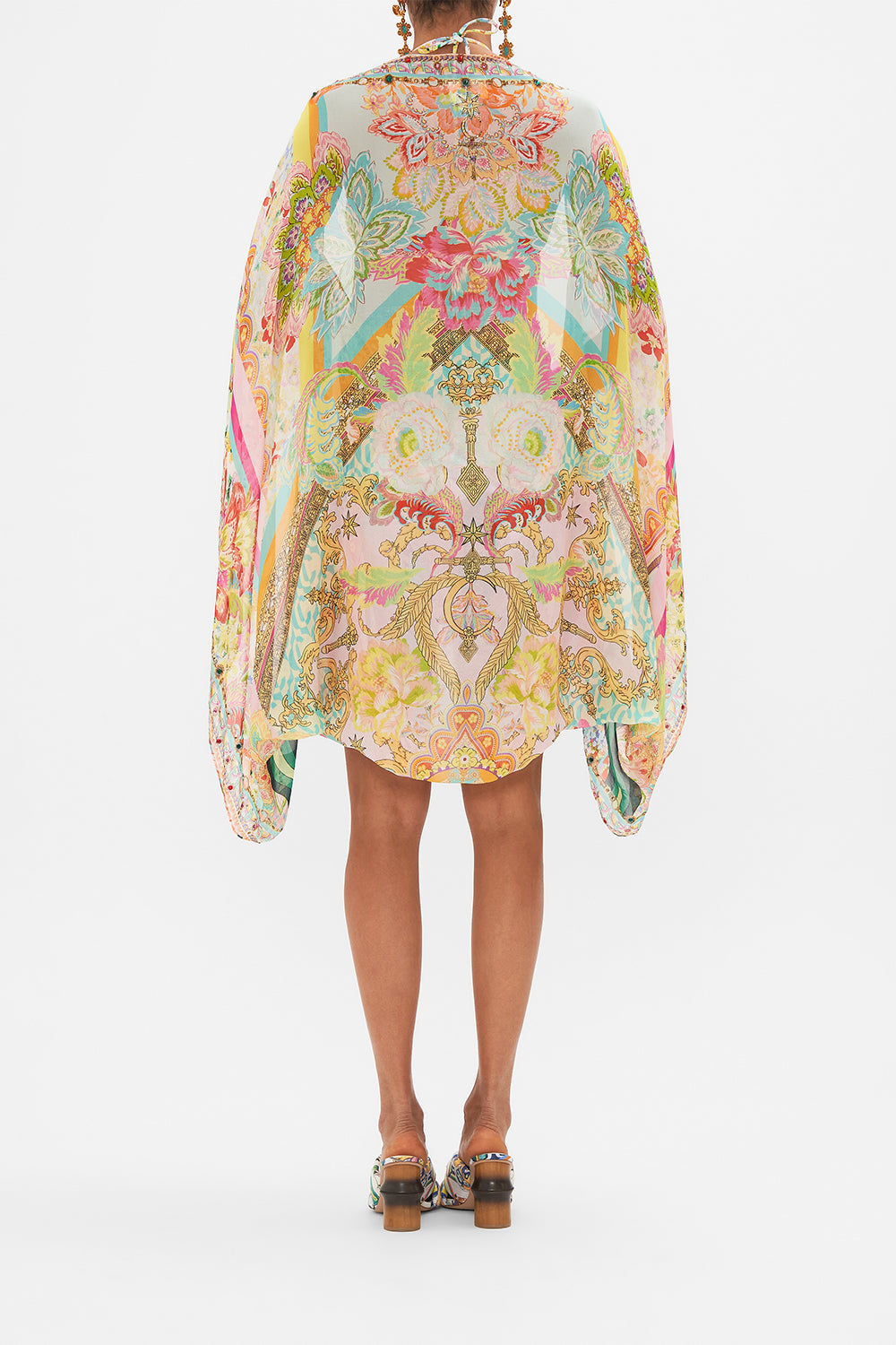 Back view of model wearing CAMILLA silk shrug in An Italian Welcome print