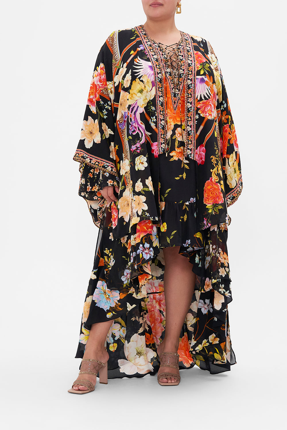 Front view of curvy model wearing CAMILLA plus size silk kimono layer in Secret History print