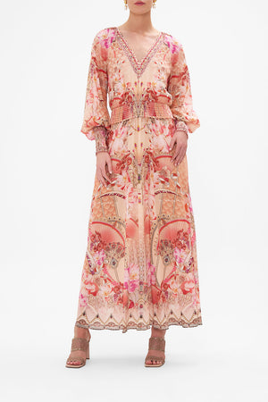 Front view of model wearing CAMILLA pink floral silk dress in Adore Me print