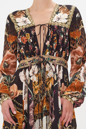 Detail view of model wearing CAMILLA brown floral mini dress in Wave Your Wand print